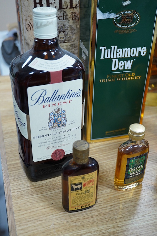 Ten bottles of Whisky including a gallon bottle of Bells. , Condition - good